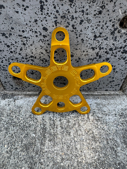 front view of bullseye 5 bolt spider in gold