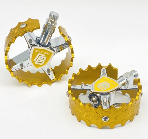 top view of billet bmx pro shield pedals in gold